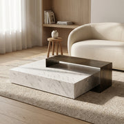 Modern living room with a marble coffee table and beige sofa.