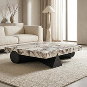 Modern living room with a marble coffee table and beige sofa.