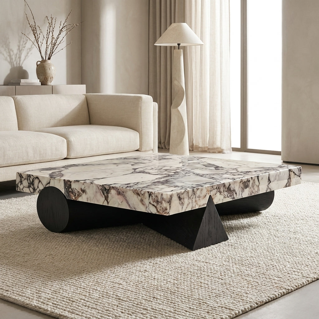 Modern living room with a marble coffee table and beige sofa.