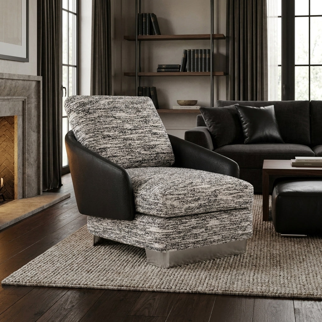Modern living room with a patterned armchair and black sofa.