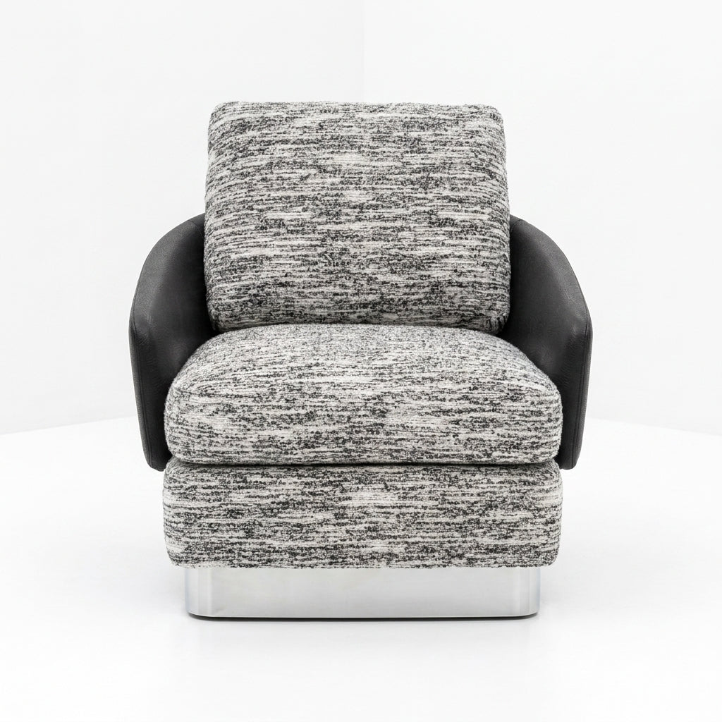 Modern armchair with gray and black patterned upholstery on a white background