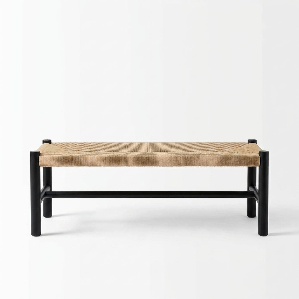 A modern low bench with a black metal frame and a natural woven rope seat, shown against a plain white studio background.