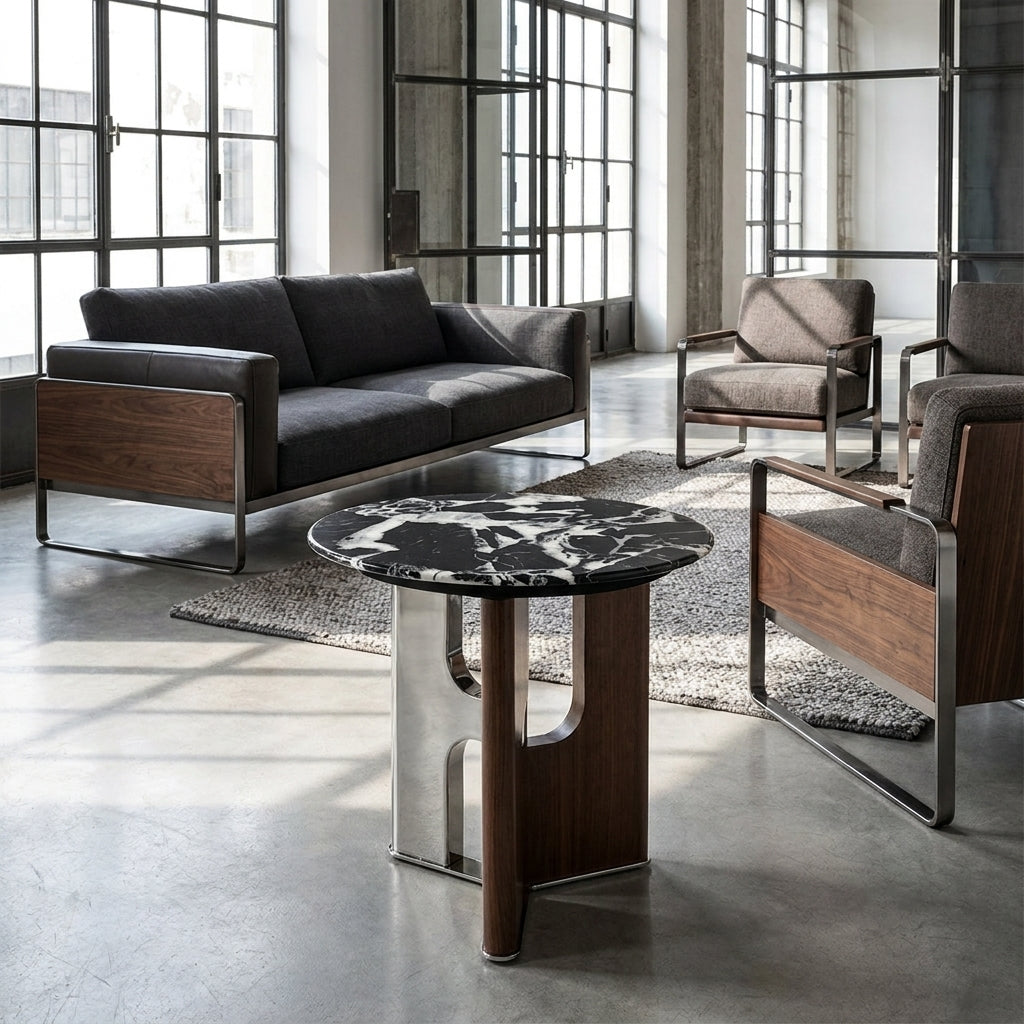 Modern living room with gray sofa, chairs, and a decorative table.
