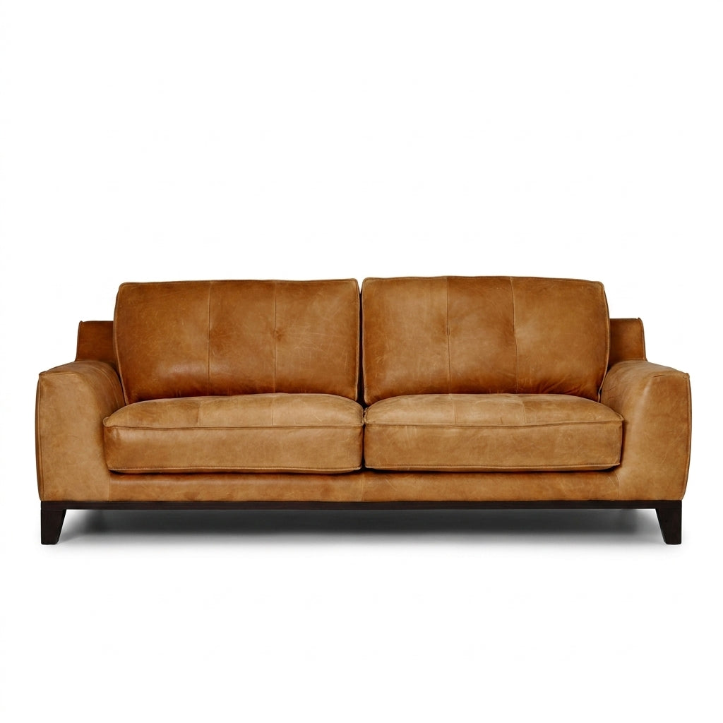 A two-seater loveseat sofa upholstered in warm tan leather, shown from the front against a plain white background.