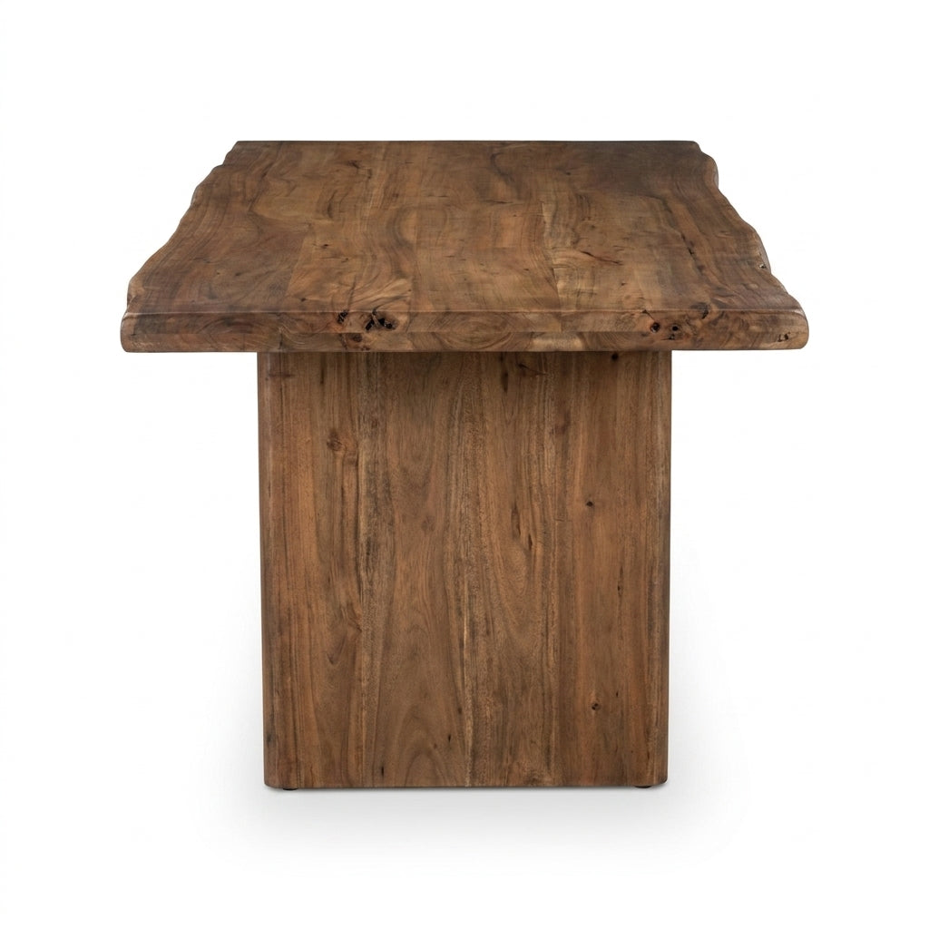 A rustic rectangular wooden table with a thick live-edge top and a solid pedestal base, shown against a plain white background.