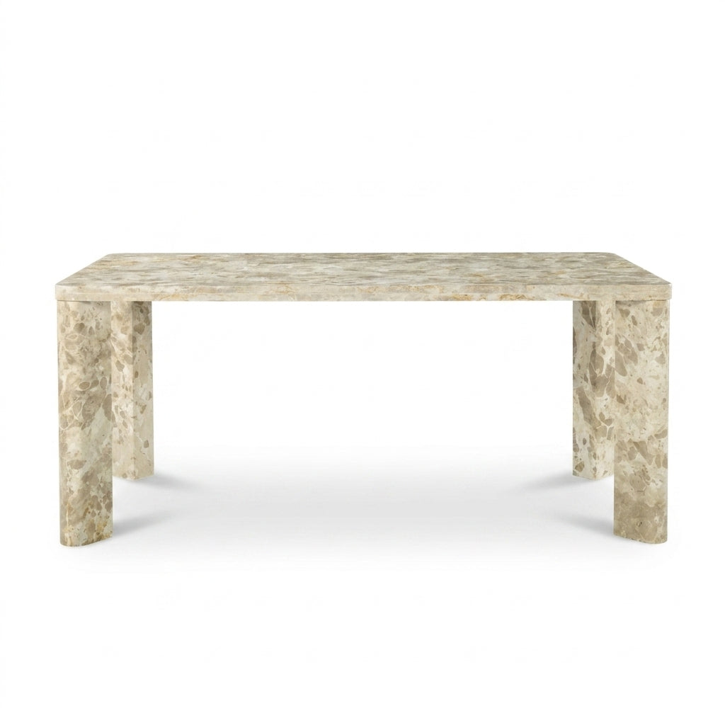 A rectangular console table made of beige and cream marble with natural veining, featuring thick block legs, shown against a plain white background.