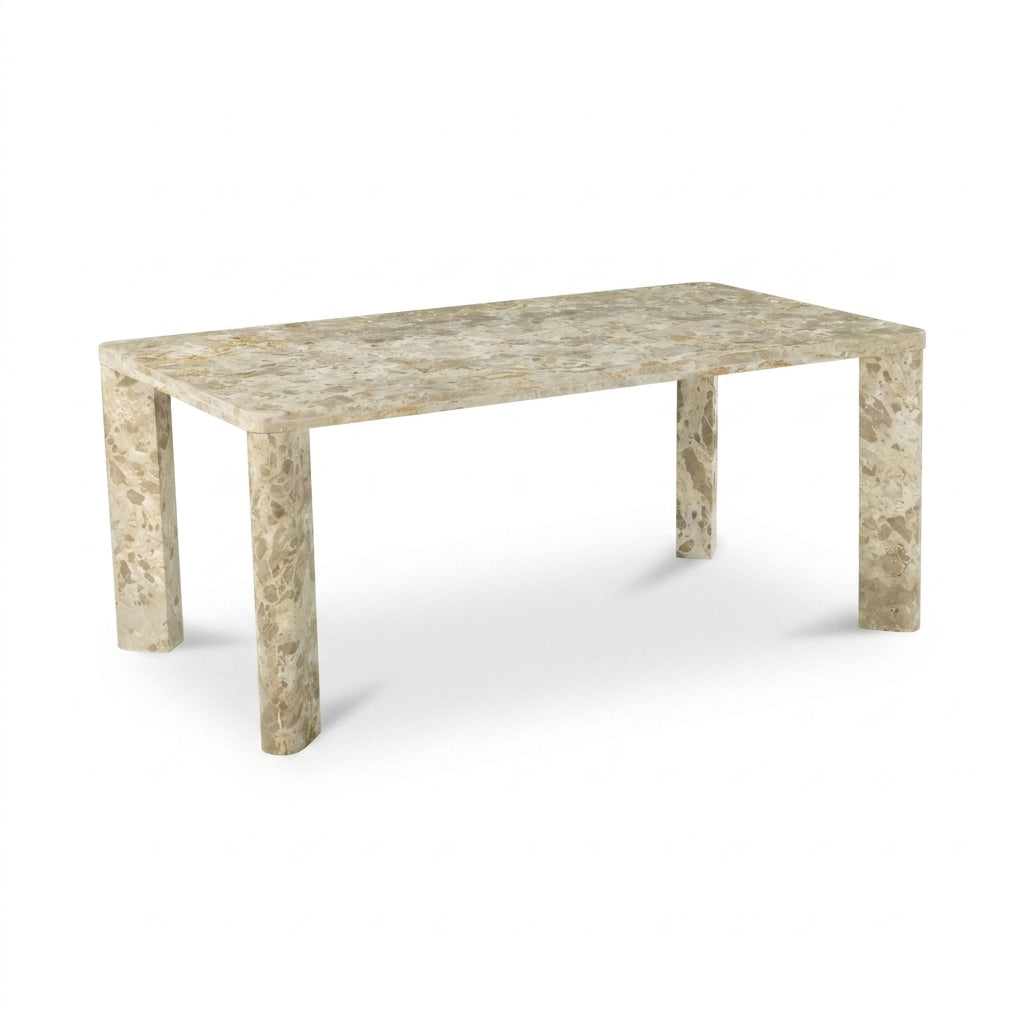 A rectangular stone table with a warm beige and cream marble-like surface and matching thick block legs, shown on a clean white background.