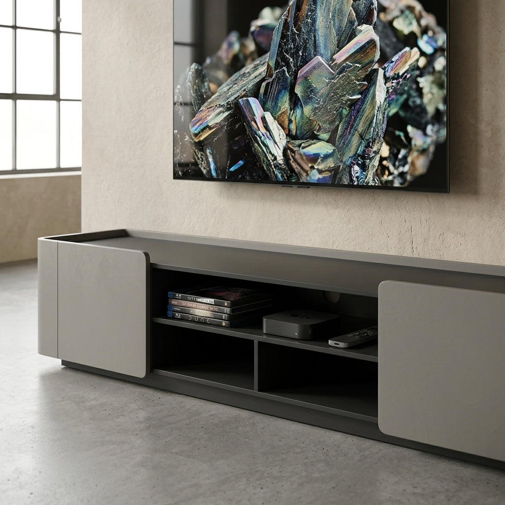 Modern TV stand with a television displaying a mineral landscape in a room with large windows.