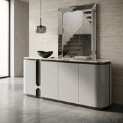 Modern white console table with marble top against a textured wall.