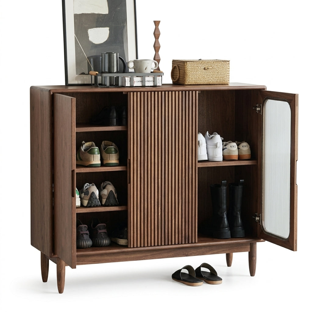 Wooden shoe cabinet with open doors displaying shoes on a white background