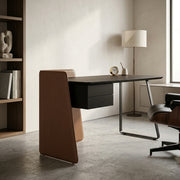 Modern office desk with chair and lamp in a minimalistic room.
