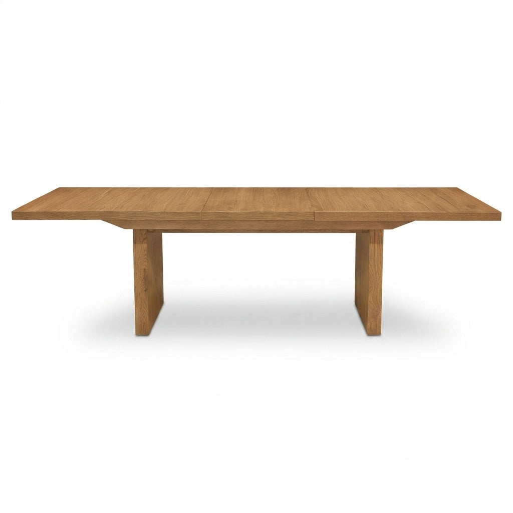 A rectangular wooden dining table with a warm medium-brown finish and blocky legs, shown from a front angle on a white background.
