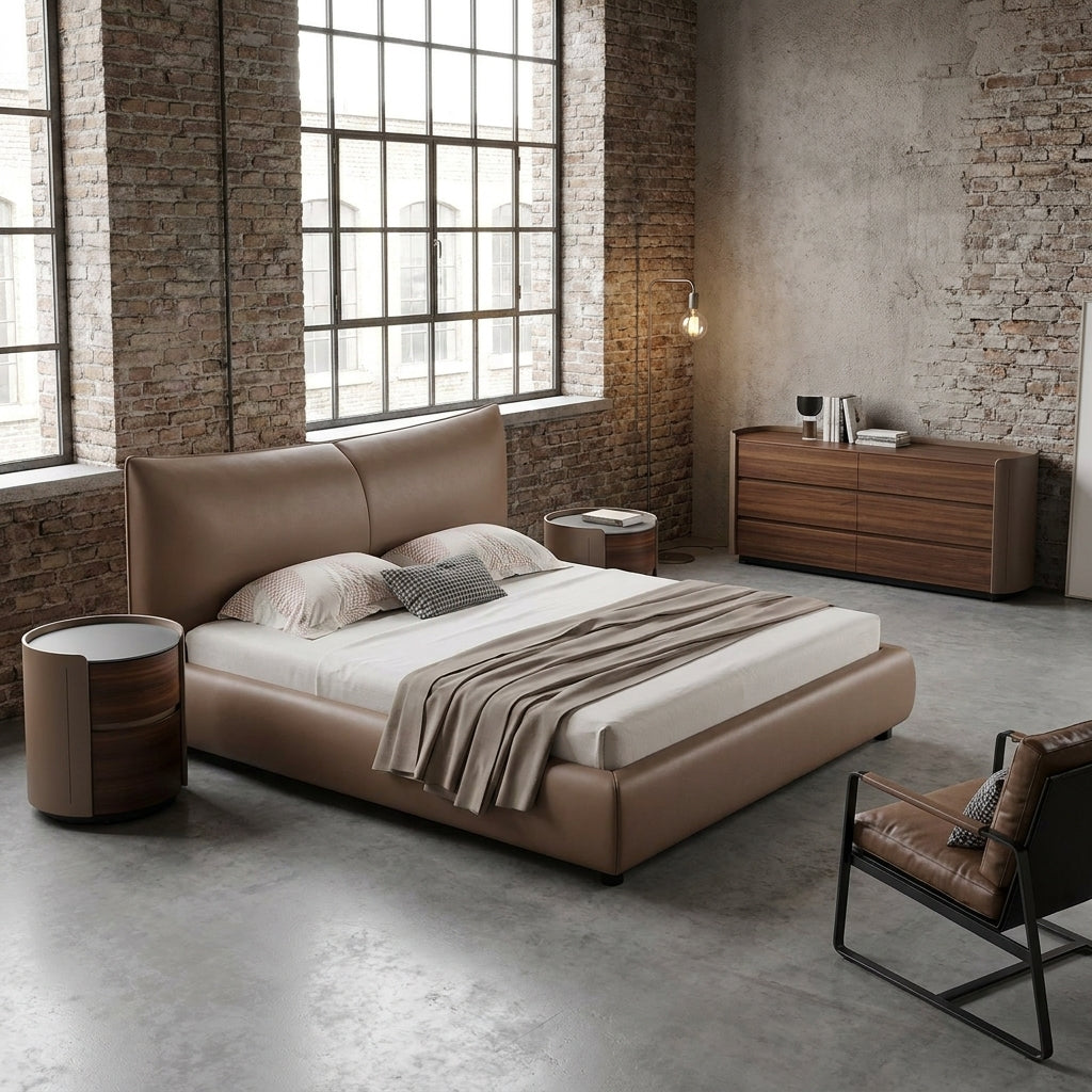 Modern bedroom with a brown bed, wooden dresser, and brick walls.