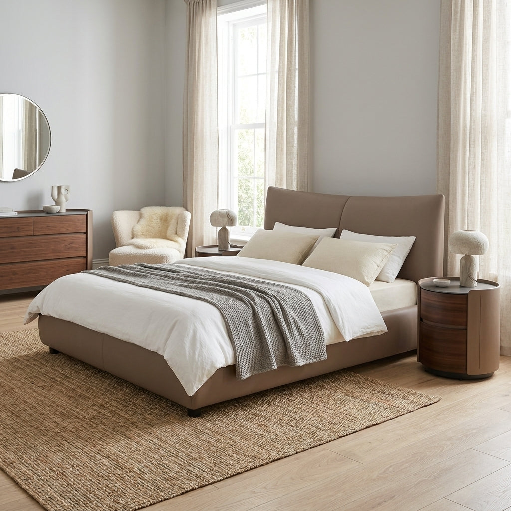 Modern bed with leather headboard in a bright room