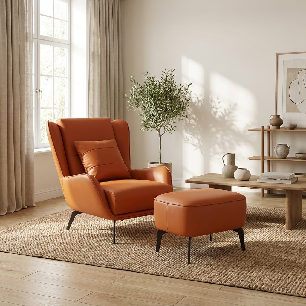 Orange armchair and ottoman in a living room with a plant and coffee table.
