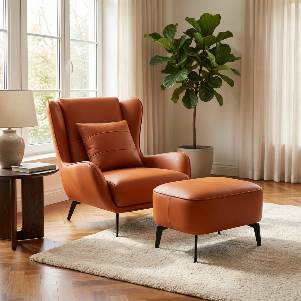 Orange armchair and ottoman with a plant in a living room setting