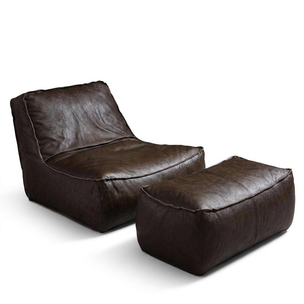 Brown leather chair and ottoman set on a white background