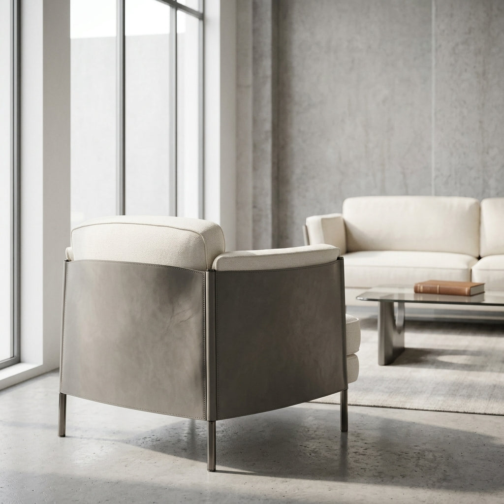 Modern living room with a gray armchair and white sofa.