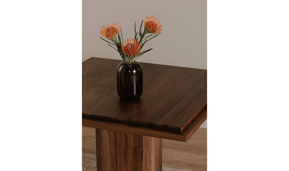 Marbella Cafe Table in Walnut, styled in a living room, view 2