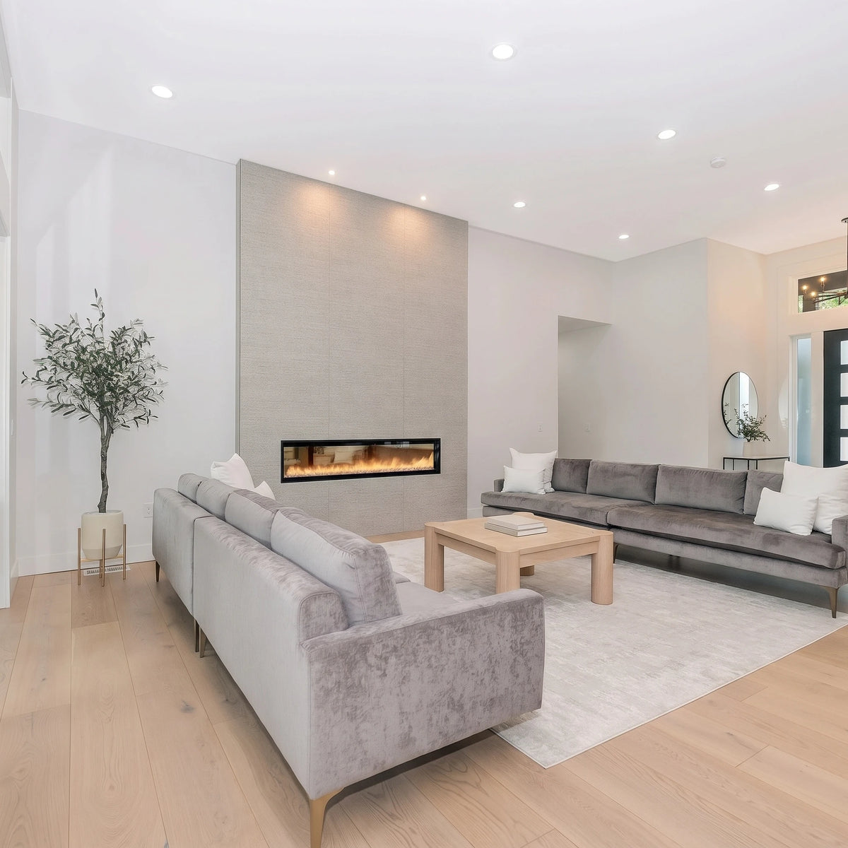 Cartmel Coffee Table in Biscotti Oak in a bright living room with grey sofas