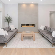 Cartmel Coffee Table, square checkerboard oak coffee table between two grey sofas by a fireplace