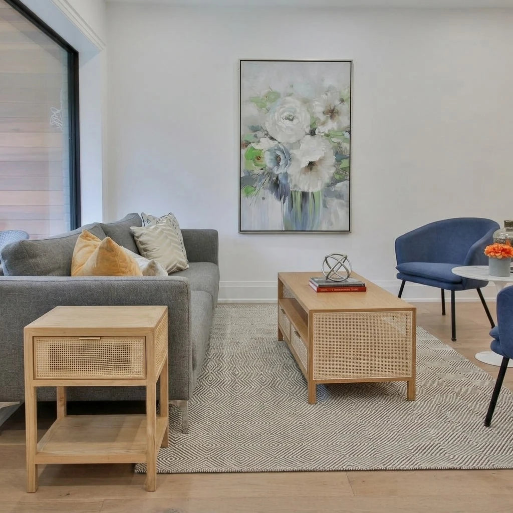 Corwin Coffee Table with a matching Corwin Side Table beside a grey sofa