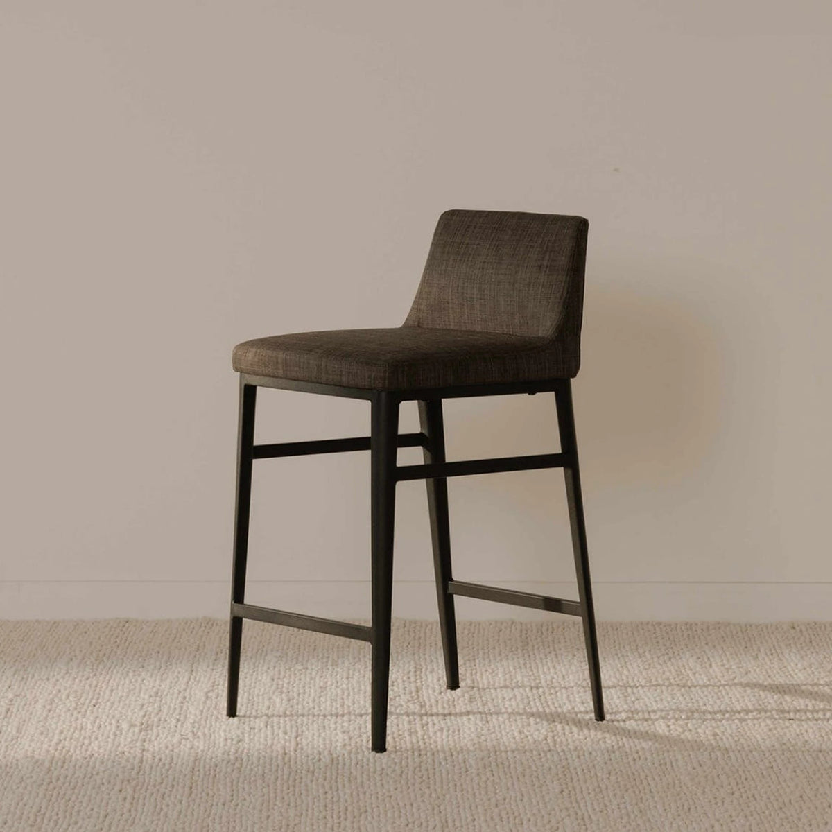 Bolsena Counter Stool in Charcoal Grey, styled in a living room