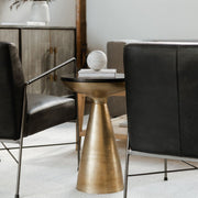 Frejus Side Table in Brass — styled in a living room