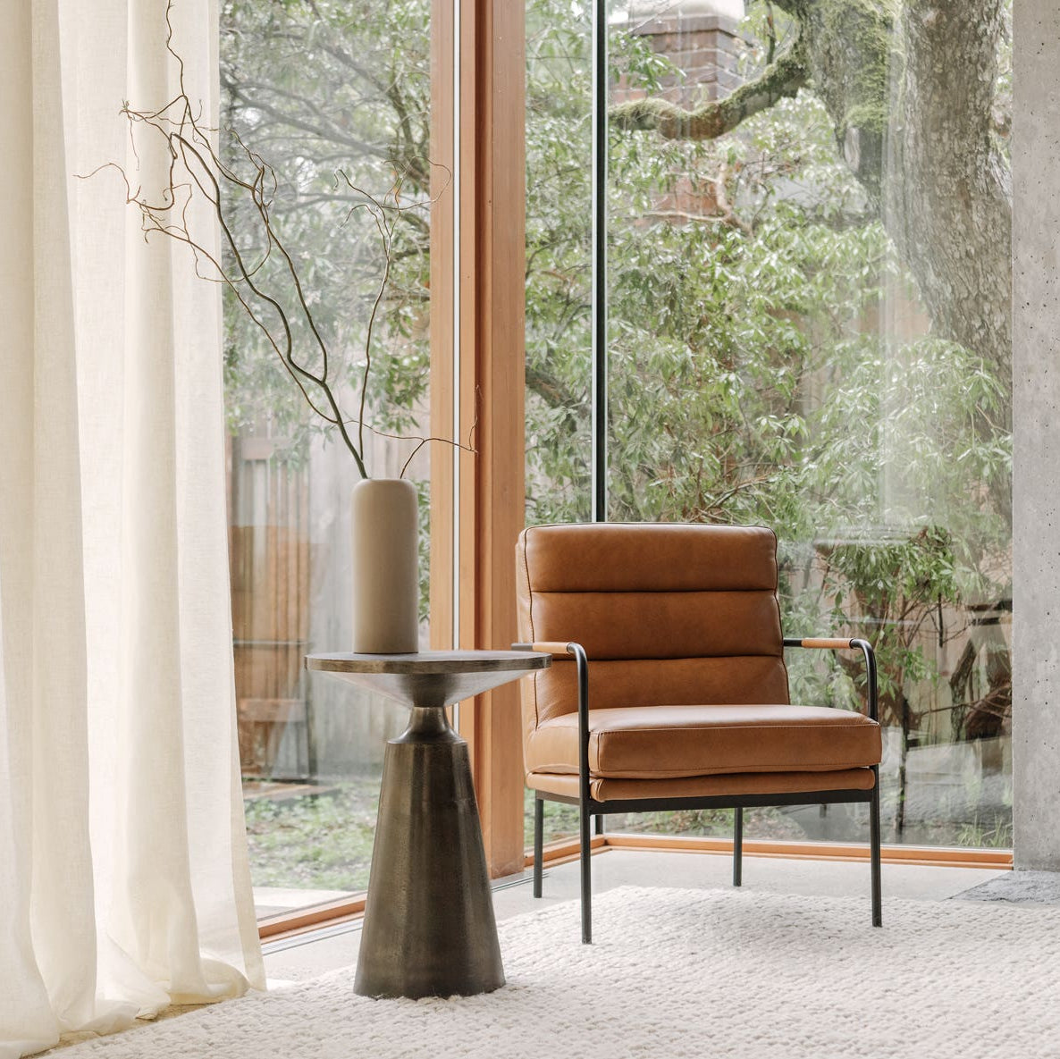 Sirmione Accent Table in Charcoal Grey — styled in a living room