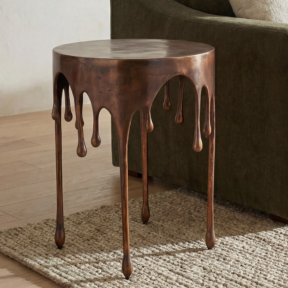 Cavan Accent Table in Antique Copper — styled in a living room