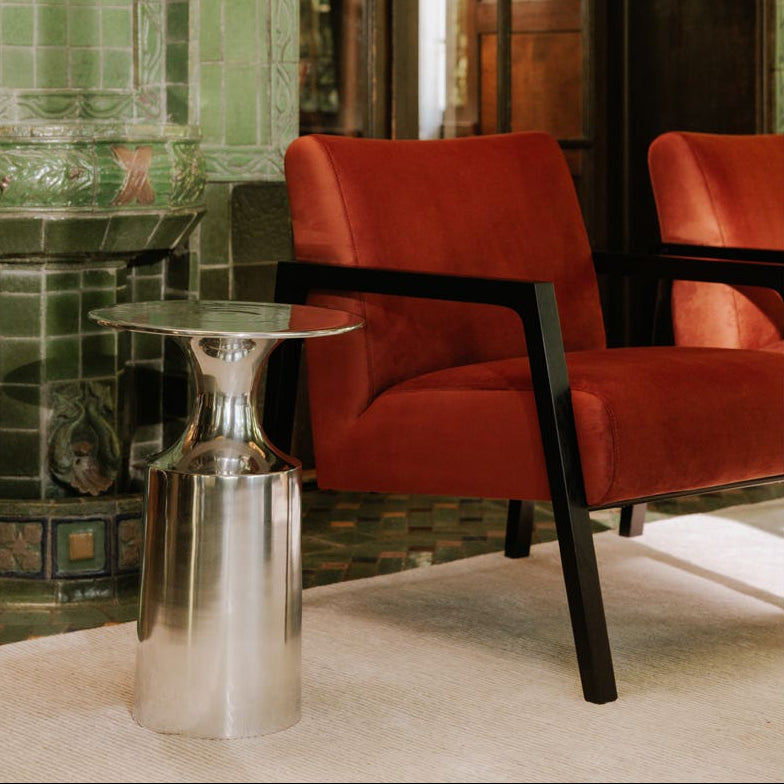 Rialto Accent Table in Polished Silver — styled in a living room
