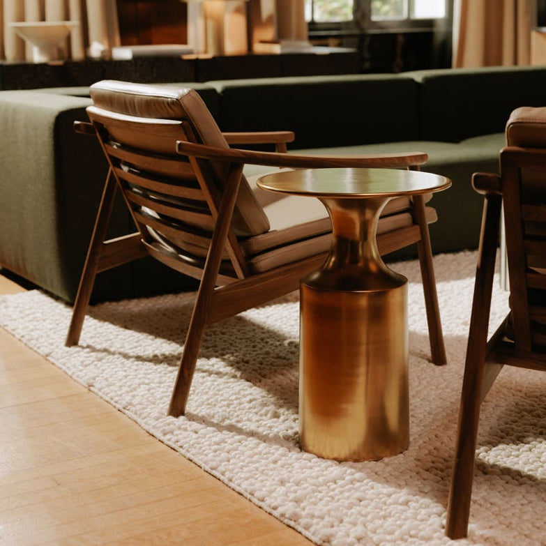 Rialto Accent Table in Gold — styled in a living room
