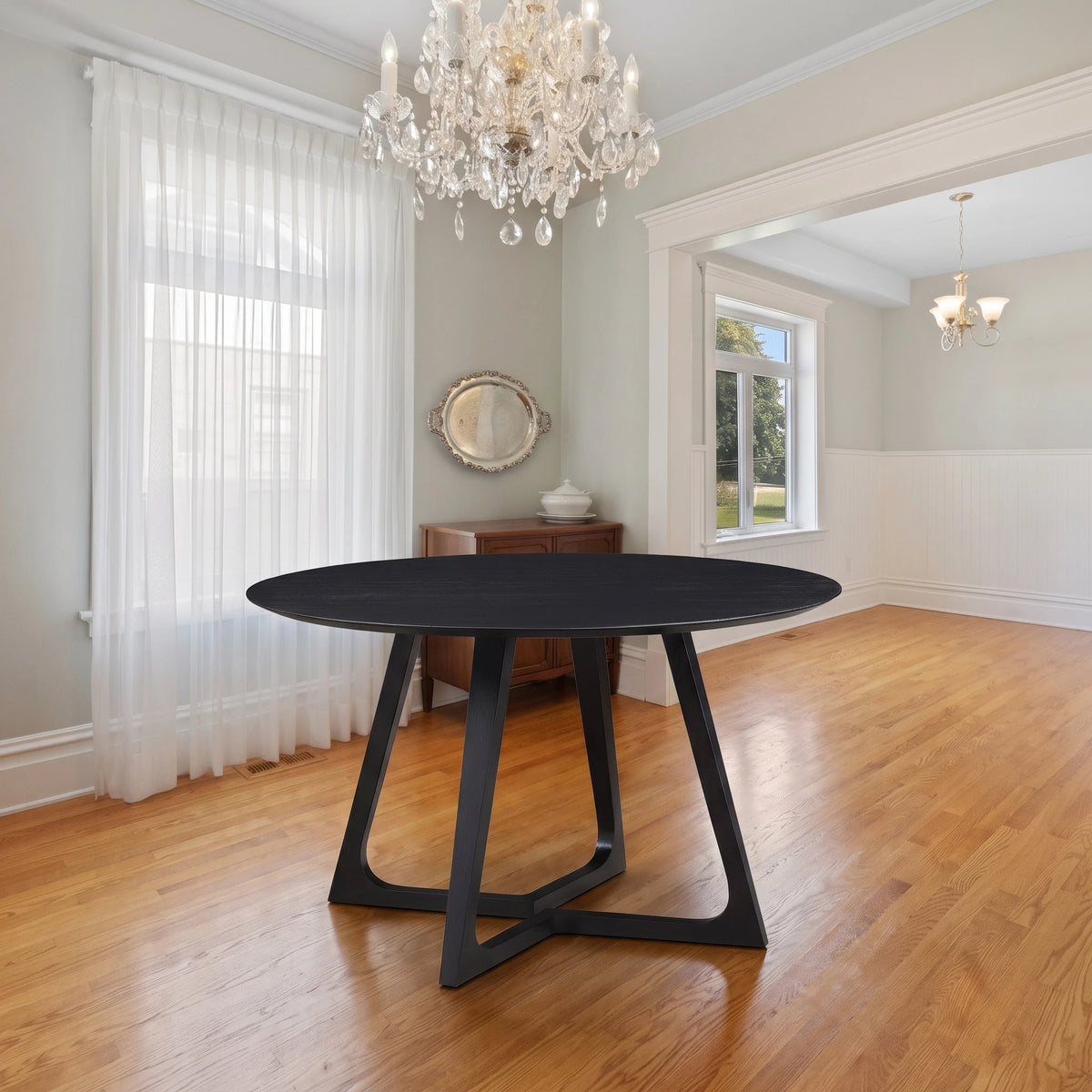 Gisborne Round Dining Table in Black on its own in a classic dining room