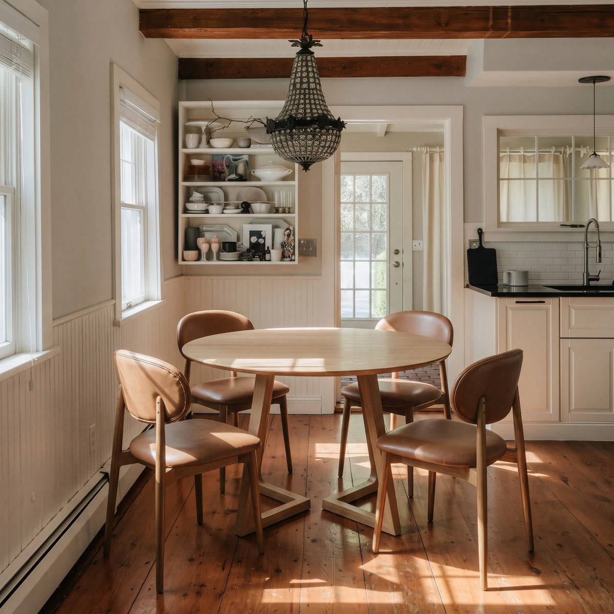 Gisborne Round Dining Table in Natural Oak with 4 Etta leather dining chairs in a farmhouse kitchen