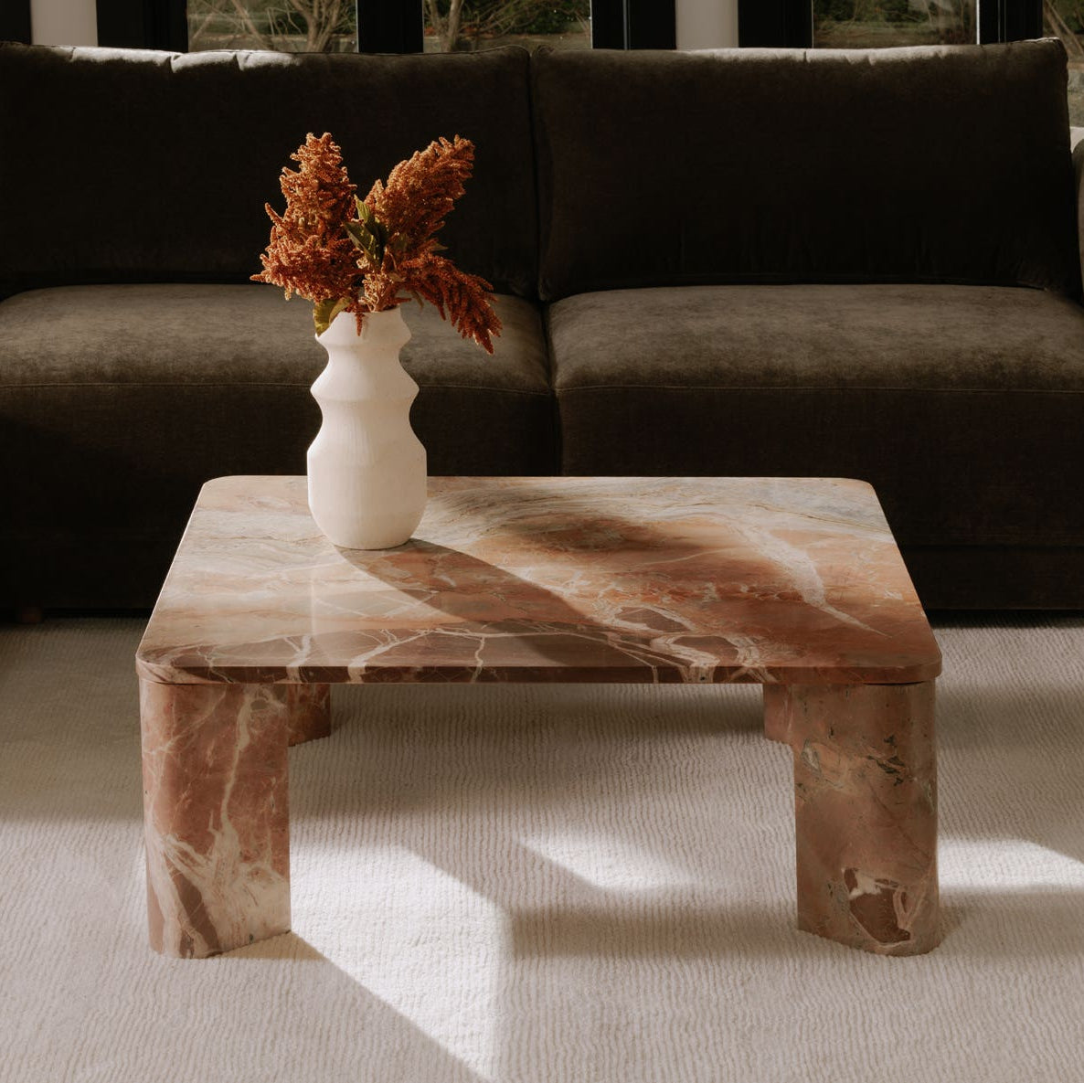 Salcombe Coffee Table in Orange Levante Marble — styled in a living room