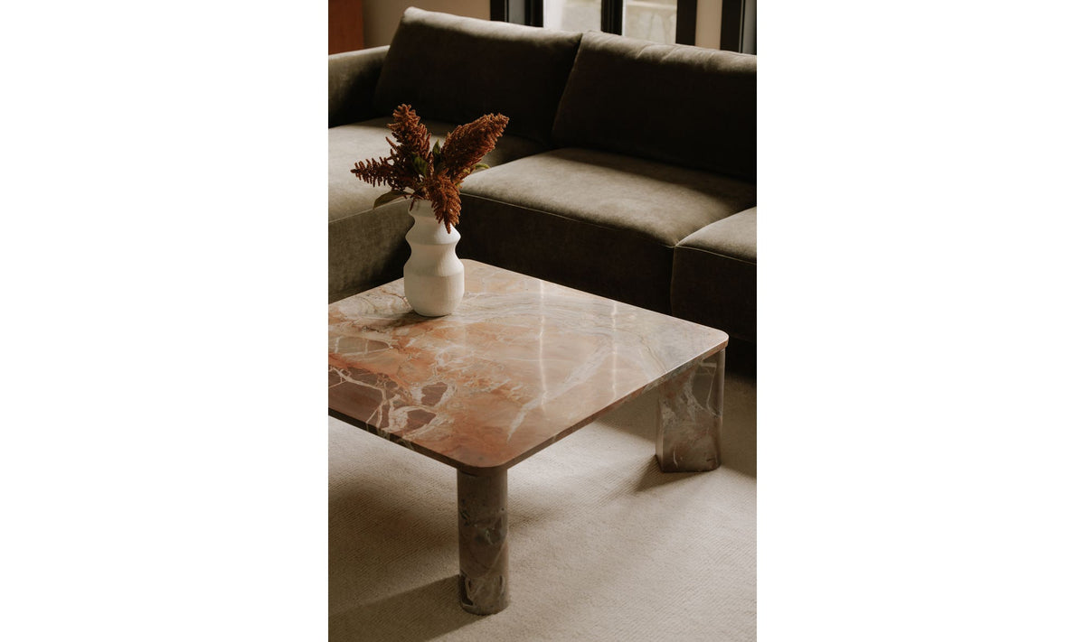 Salcombe Coffee Table in Orange Levante Marble — styled in a living room