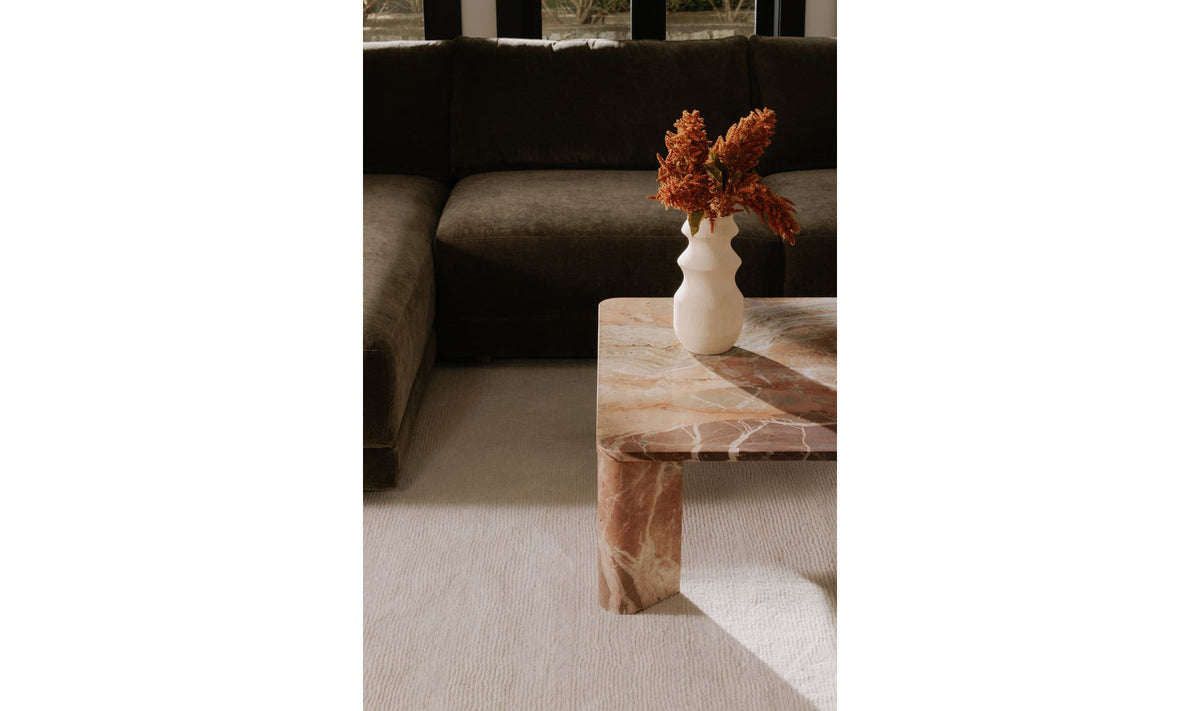 Salcombe Coffee Table in Orange Levante Marble — styled in a living room