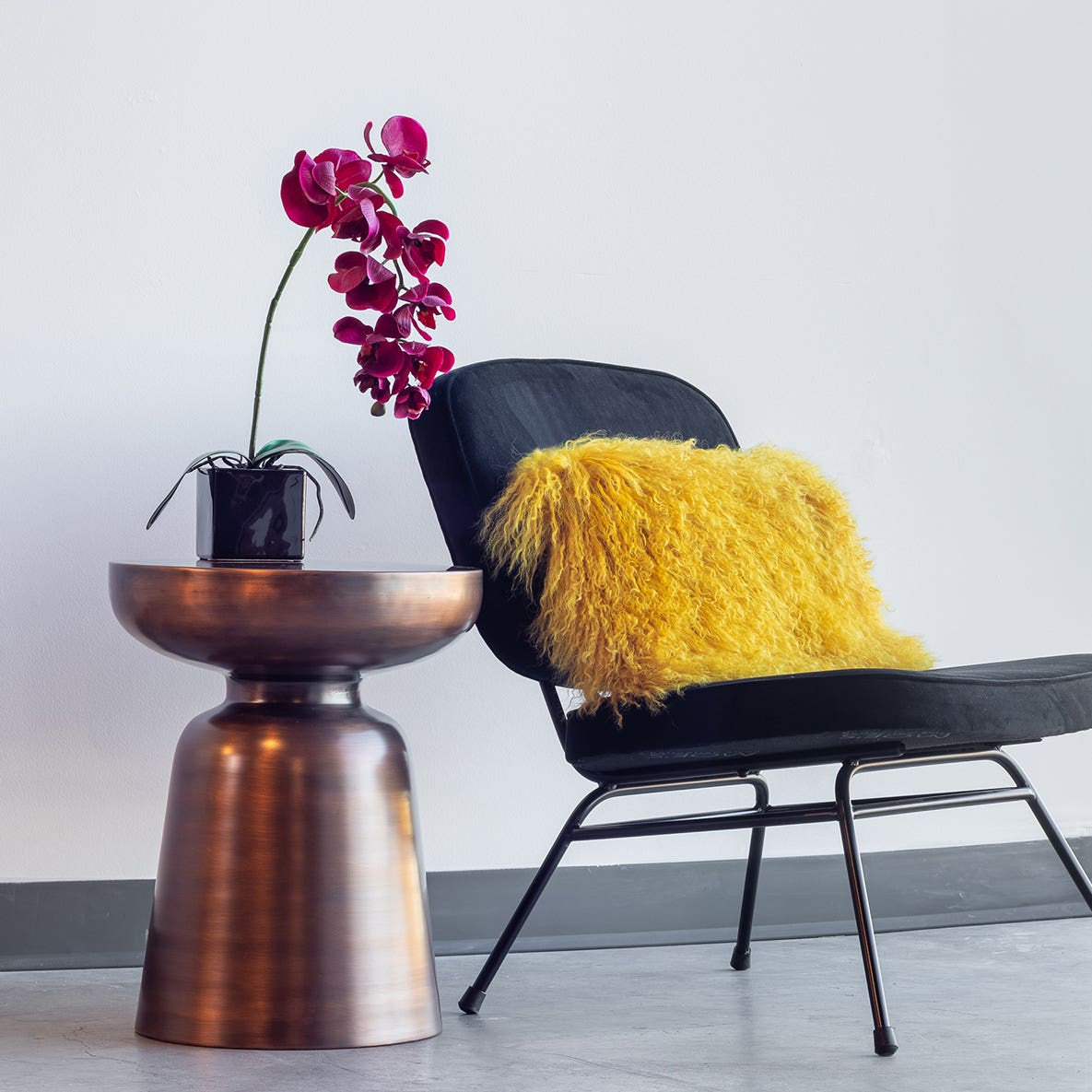 Aarau Accent Table in Antique Copper — styled in a living room