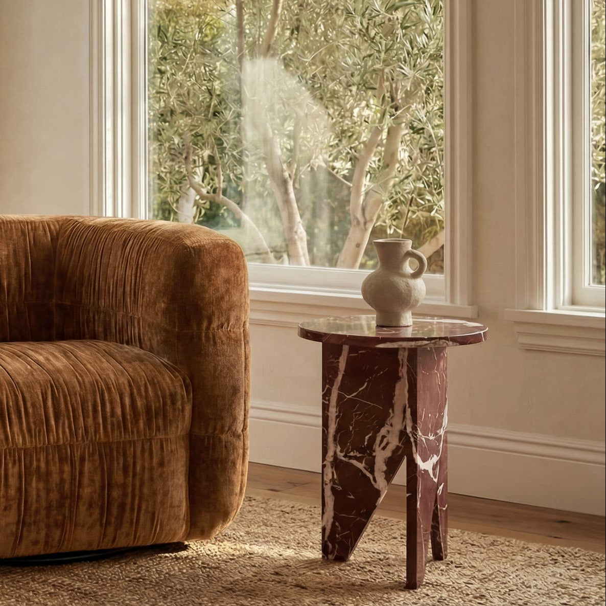 Grasse Accent Table in Rosso Levante Marble — styled in a living room