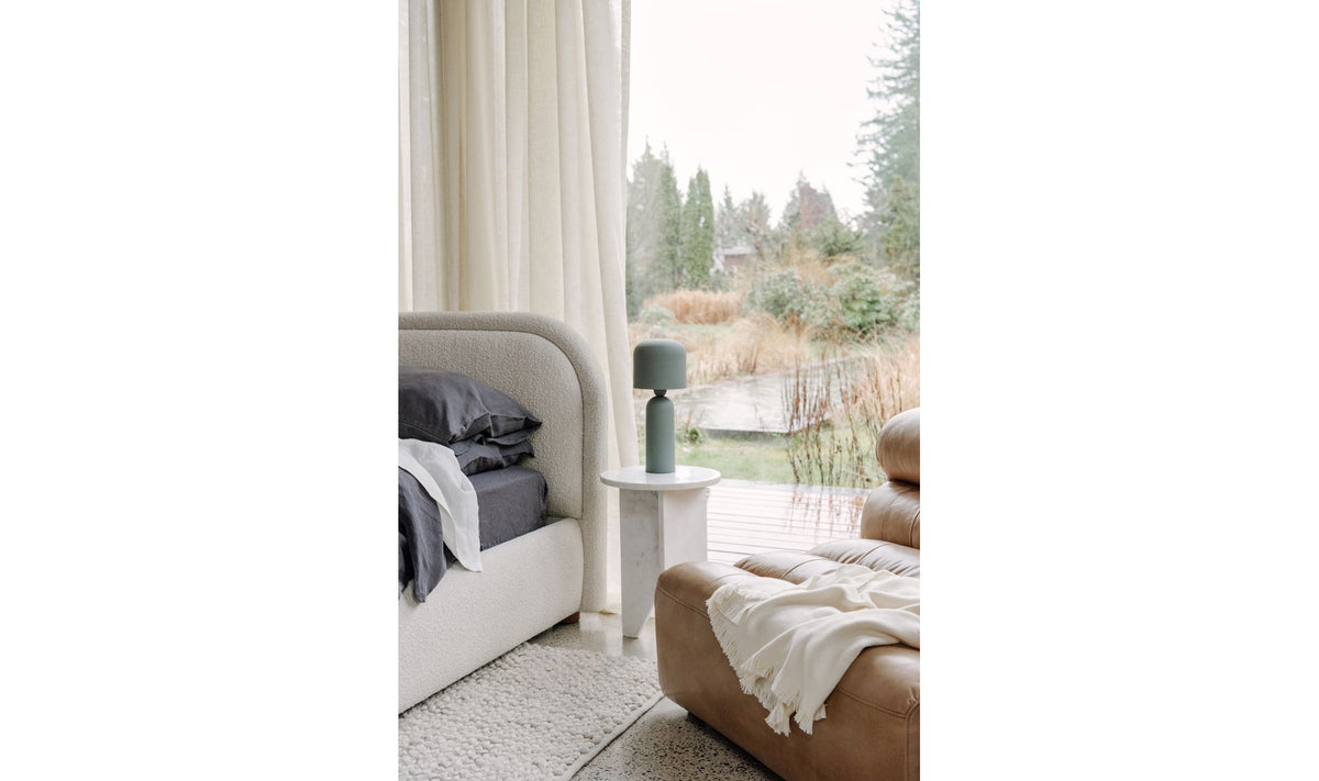 Grasse Accent Table in White Marble — styled in a living room