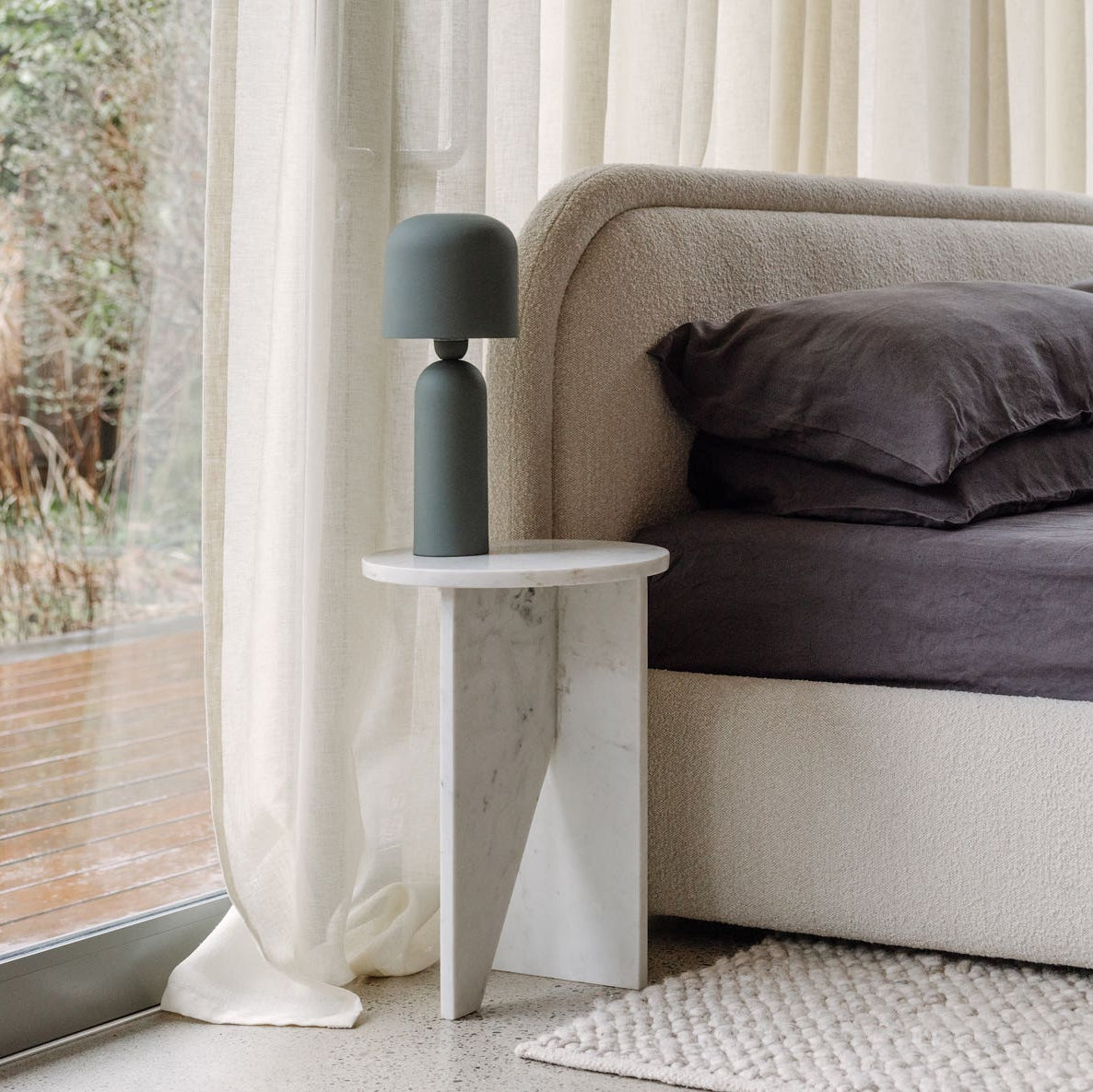 Grasse Accent Table in White Marble — styled in a living room