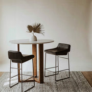 Savoy Counter Stool Set of Two in Onyx Black Leather, styled in a living room, view 2