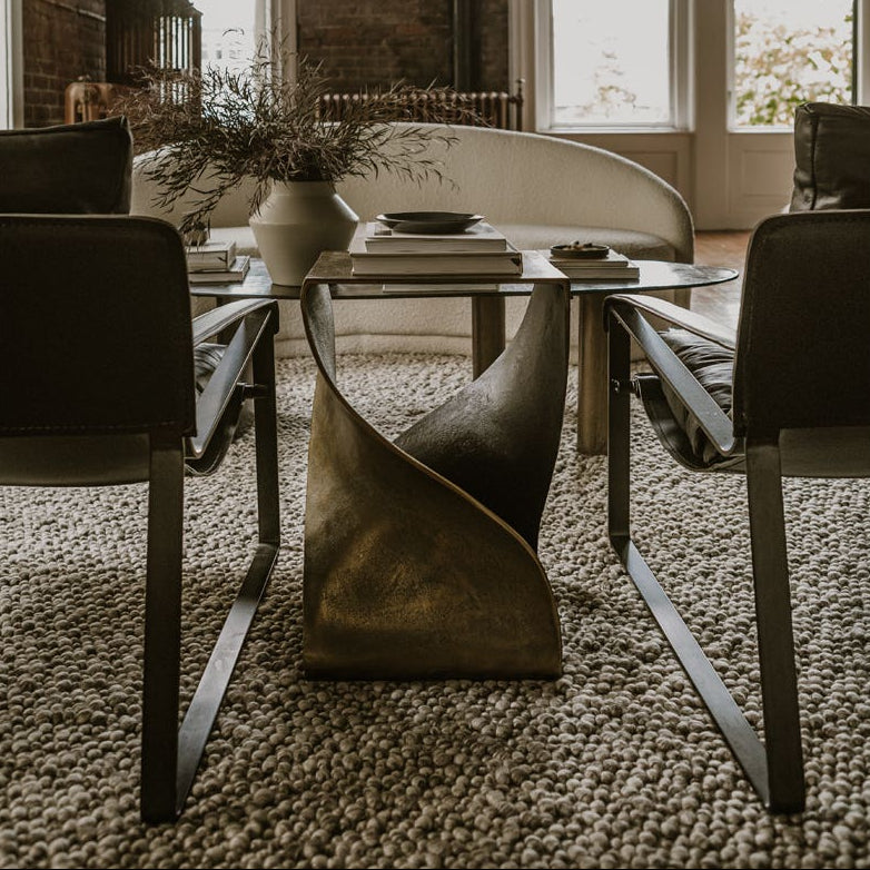 Thurso Accent Table in Brass — styled in a living room