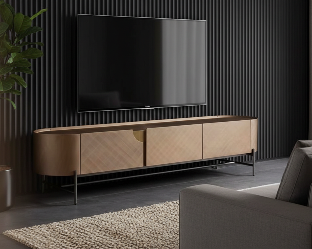 Modern living room with a large TV on a wooden stand, gray sofa, and decorative plant.