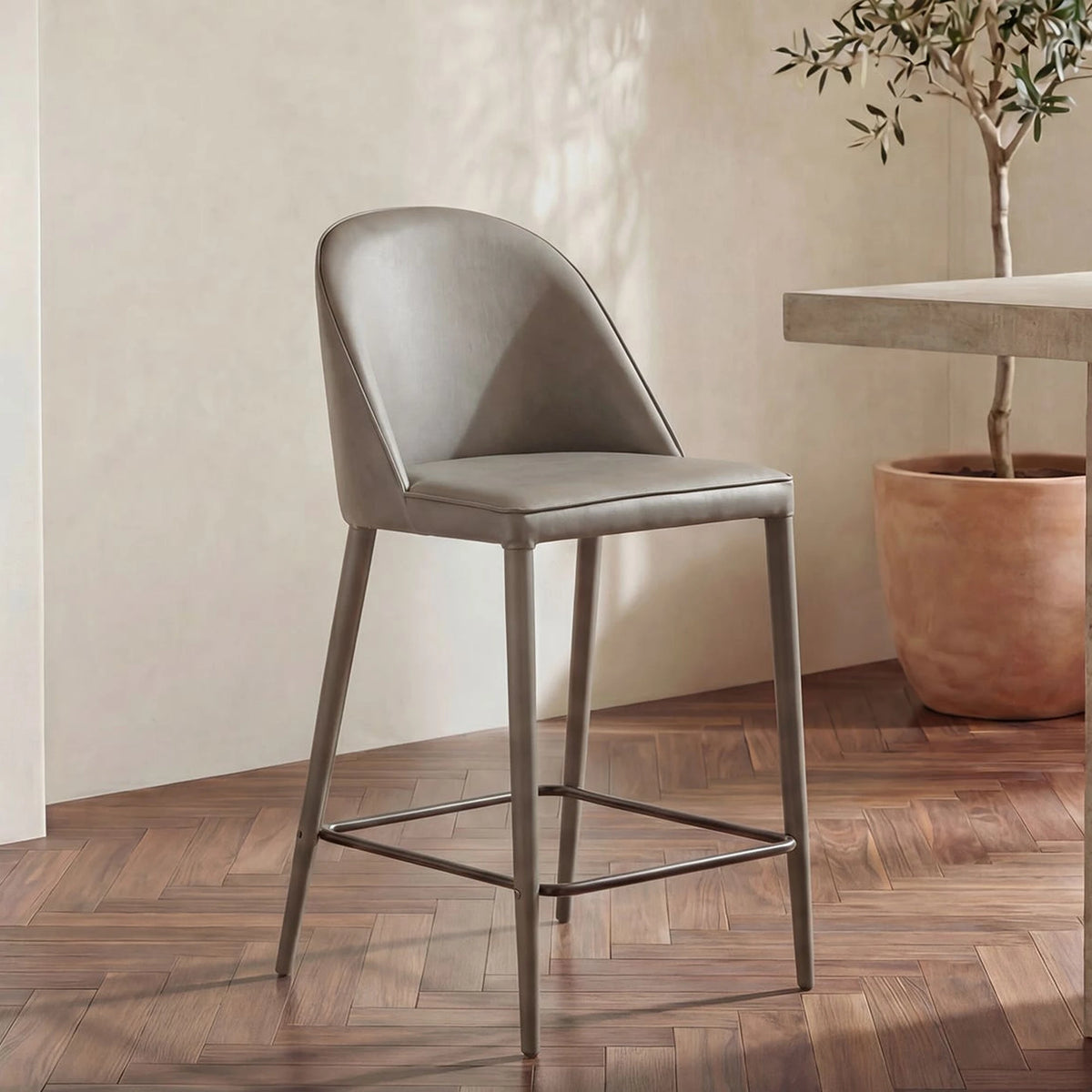 Bormio Counter Stool in Grey Vegan Leather, styled in a living room