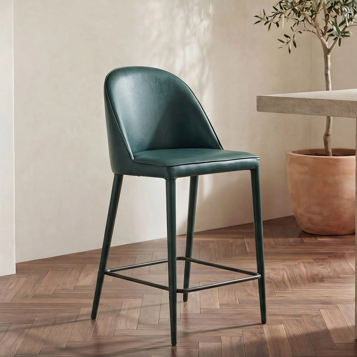 Bormio Counter Stool in Dark Teal Vegan Leather, styled in a living room